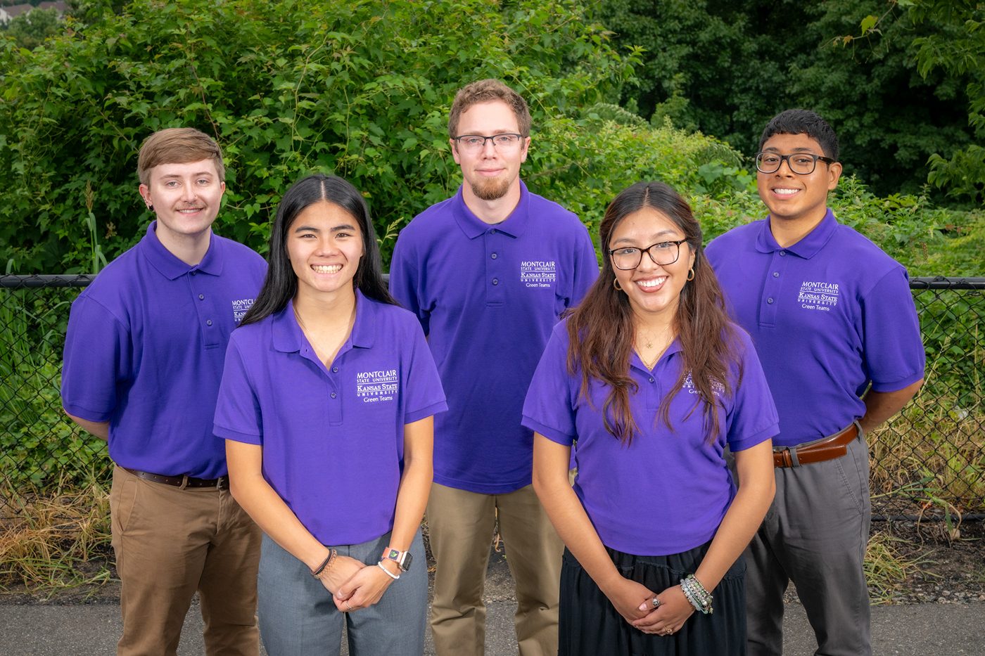 Research team in matching purple shirts
